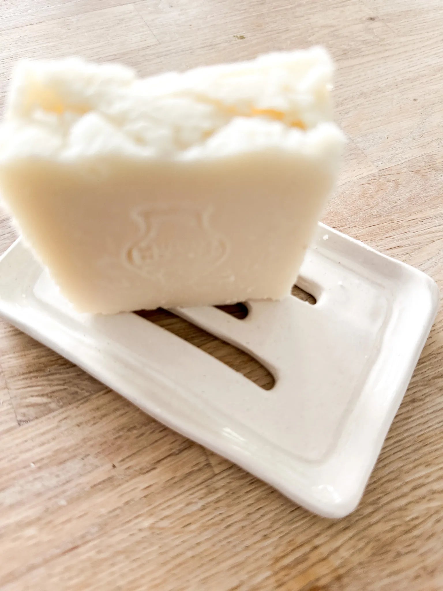 Handmade ceramic soap dish styled on a bathroom counter