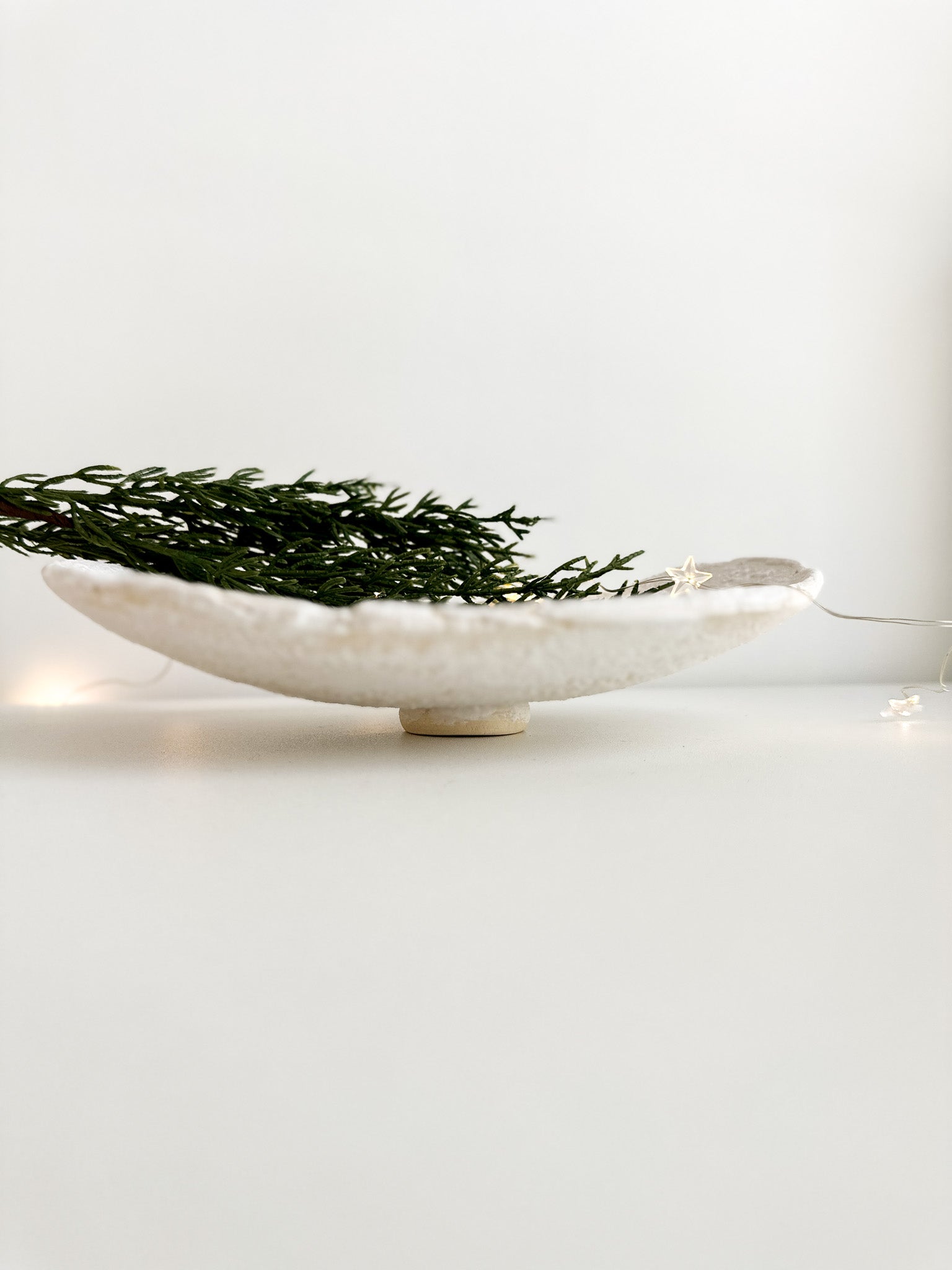 Neutral-toned footed serving dish for the table