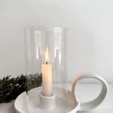 Textured white ceramic candle holder with handle and glass cover, ideal for mediterranean and european farmhouse interiors. This handmade piece makes a unique gift for housewarmings, weddings, or any special occasion