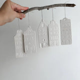Set of porcelain row-house ornaments for the Christmas tree