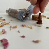 Natural incense cones and burner disc styled together