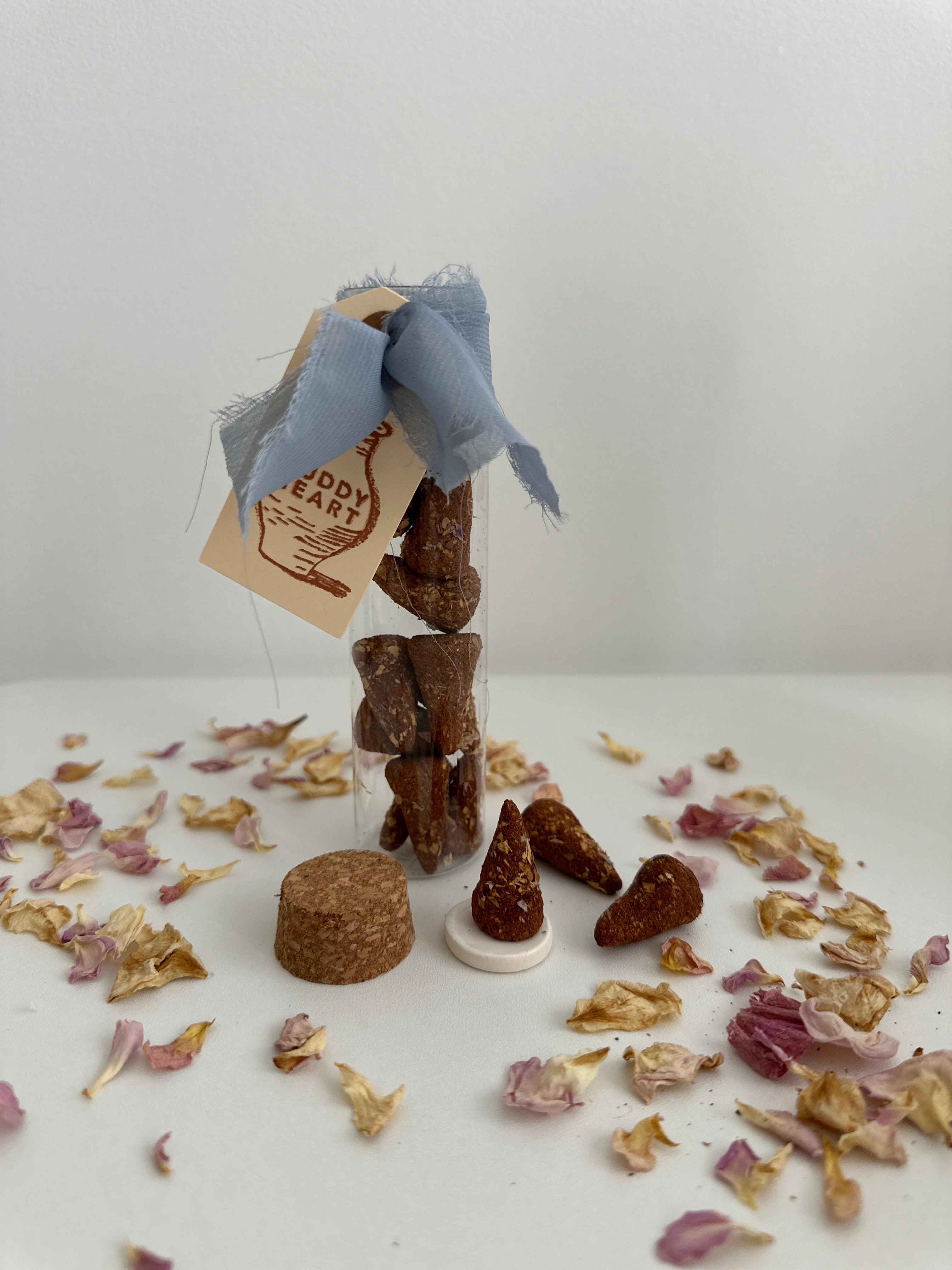Incense cone resting on a small ceramic dish