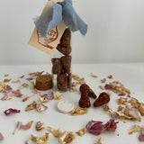 Natural hand-rolled incense cones with a small ceramic burner disc