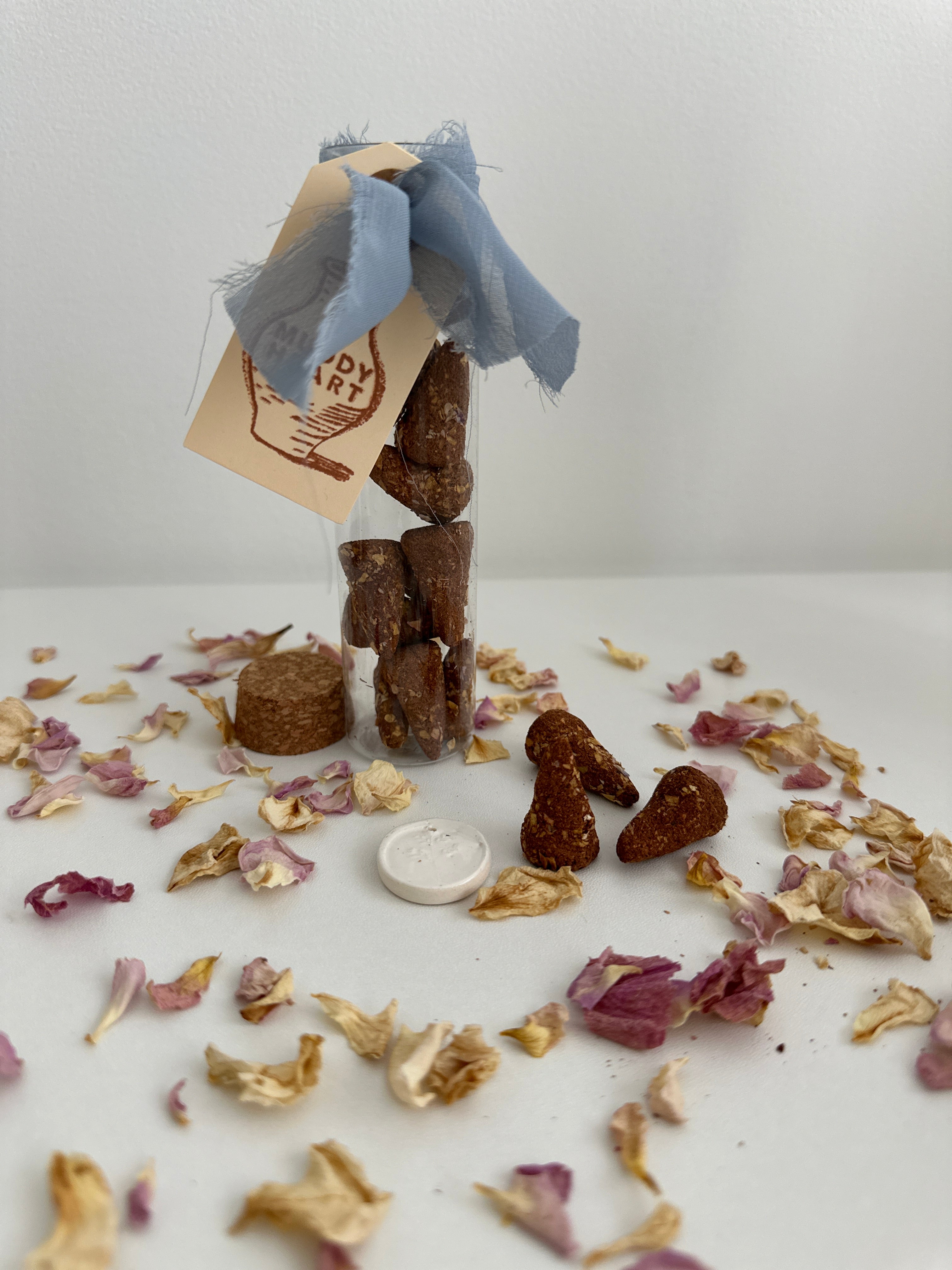 Natural hand-rolled incense cones with a small ceramic burner disc