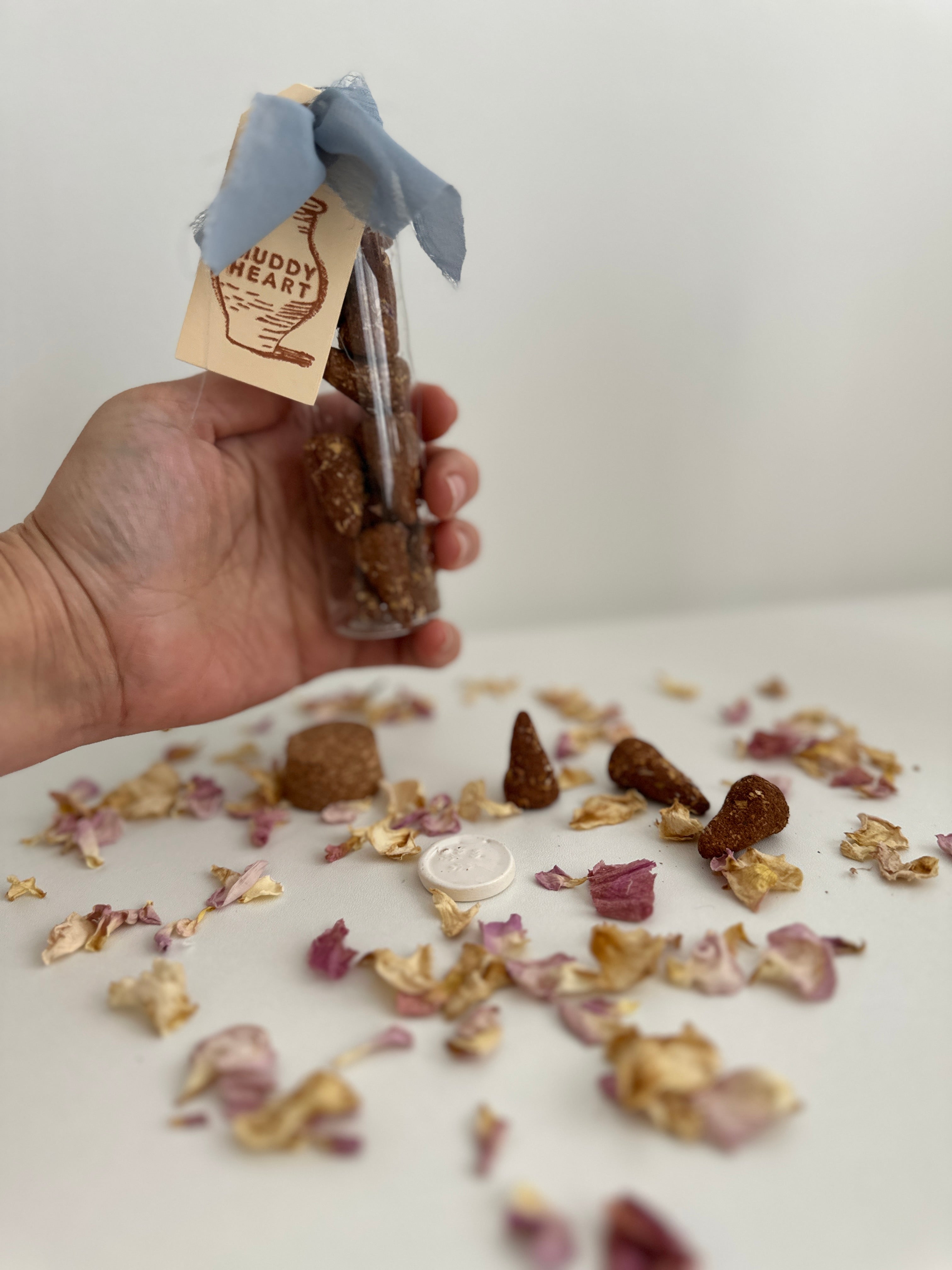 Completely natural hand-rolled incense cones grouped in a small pile