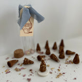 Close-up of a hand-rolled natural incense cone
