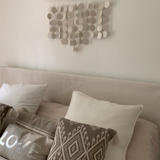 Stylish coastal home decor with hanging ceramic discs
