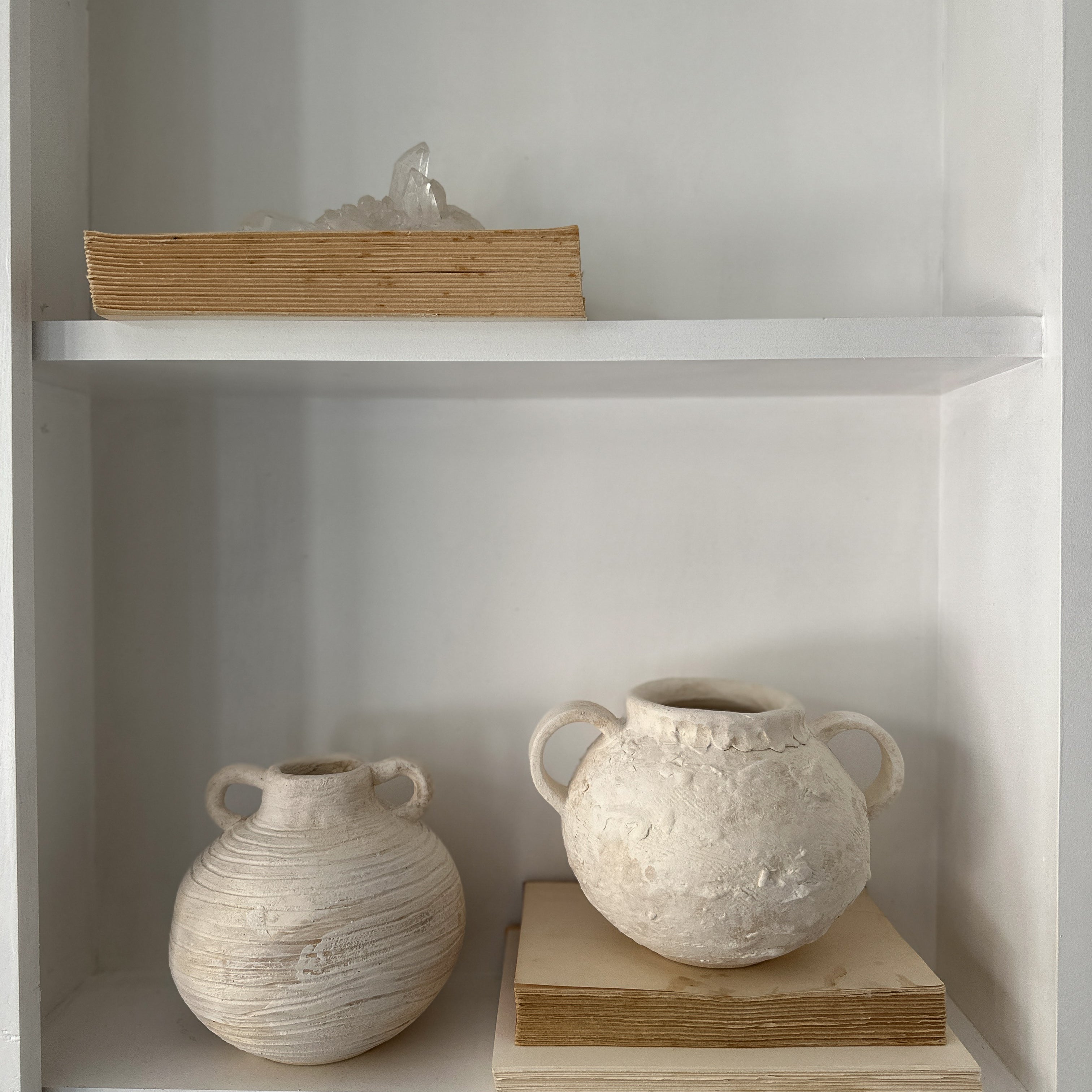 Handmade wide banded stoneware vessel with a raw clay exterior