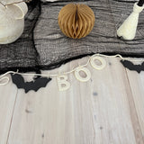 Handmade stoneware garland spelling BOO in ceramic letters on natural cotton rope.