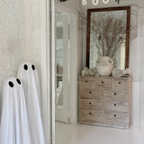 Handmade stoneware garland spelling BOO in ceramic letters on natural cotton rope.
