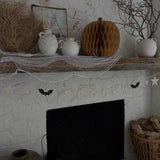 Handmade stoneware Halloween garland spelling SPOOKY on natural cotton rope in neutral tones.