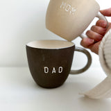 Mom and Dad ceramic mugs, a handmade new-parent gift