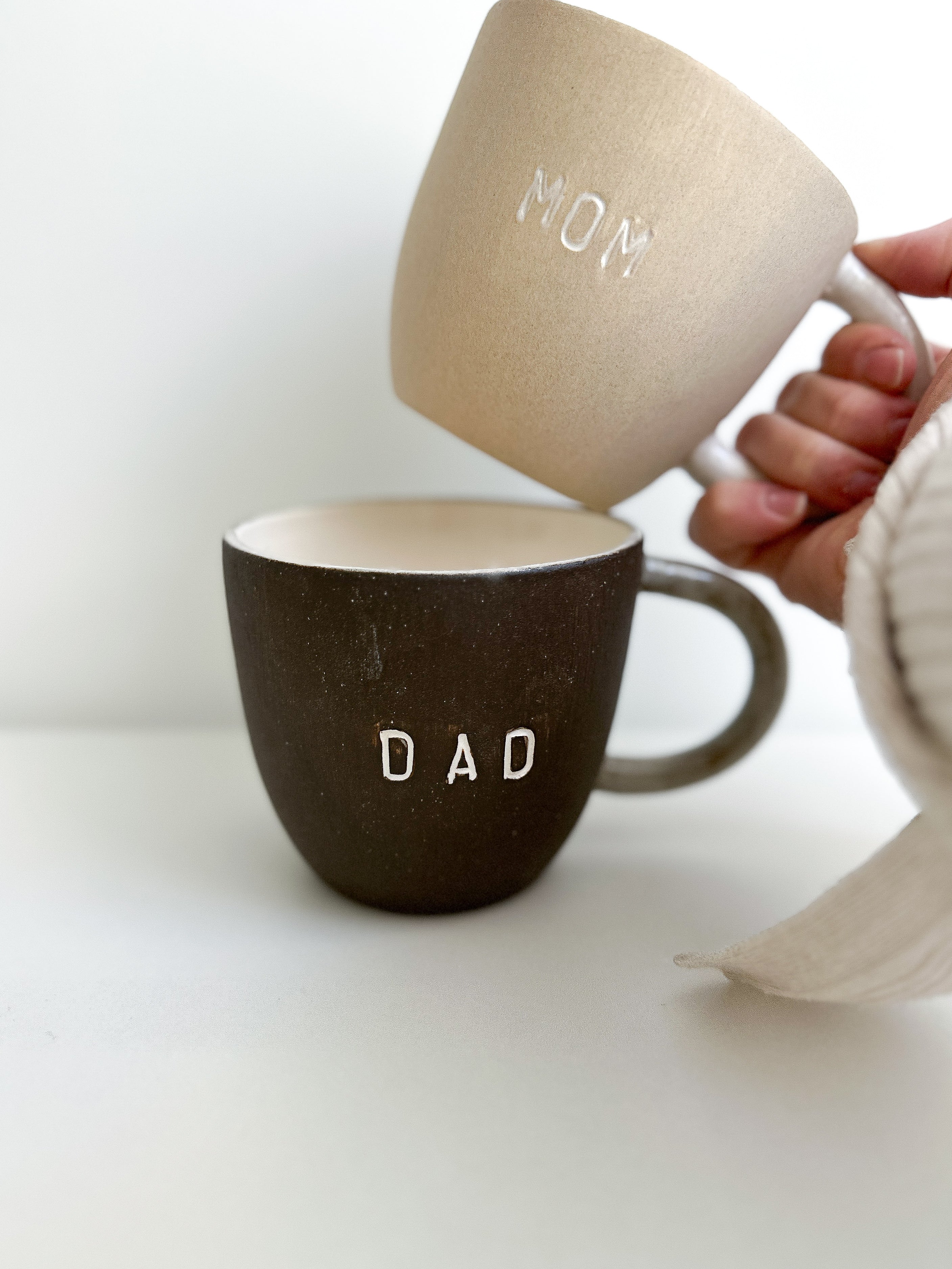 Mom and Dad ceramic mugs, a handmade new-parent gift