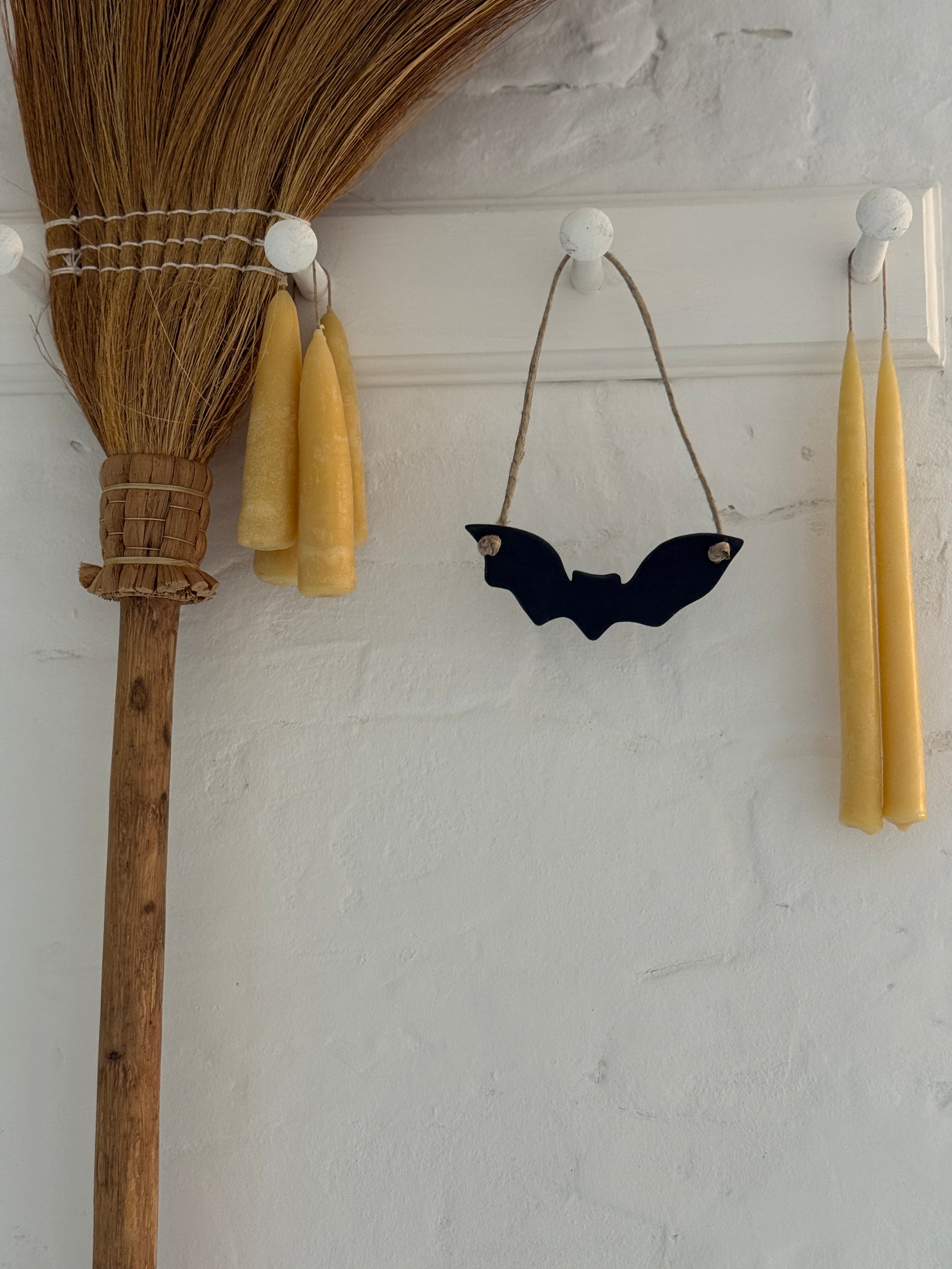 Handmade stoneware bat ornaments in three sizes for hanging on knobs, branches, or wreaths.