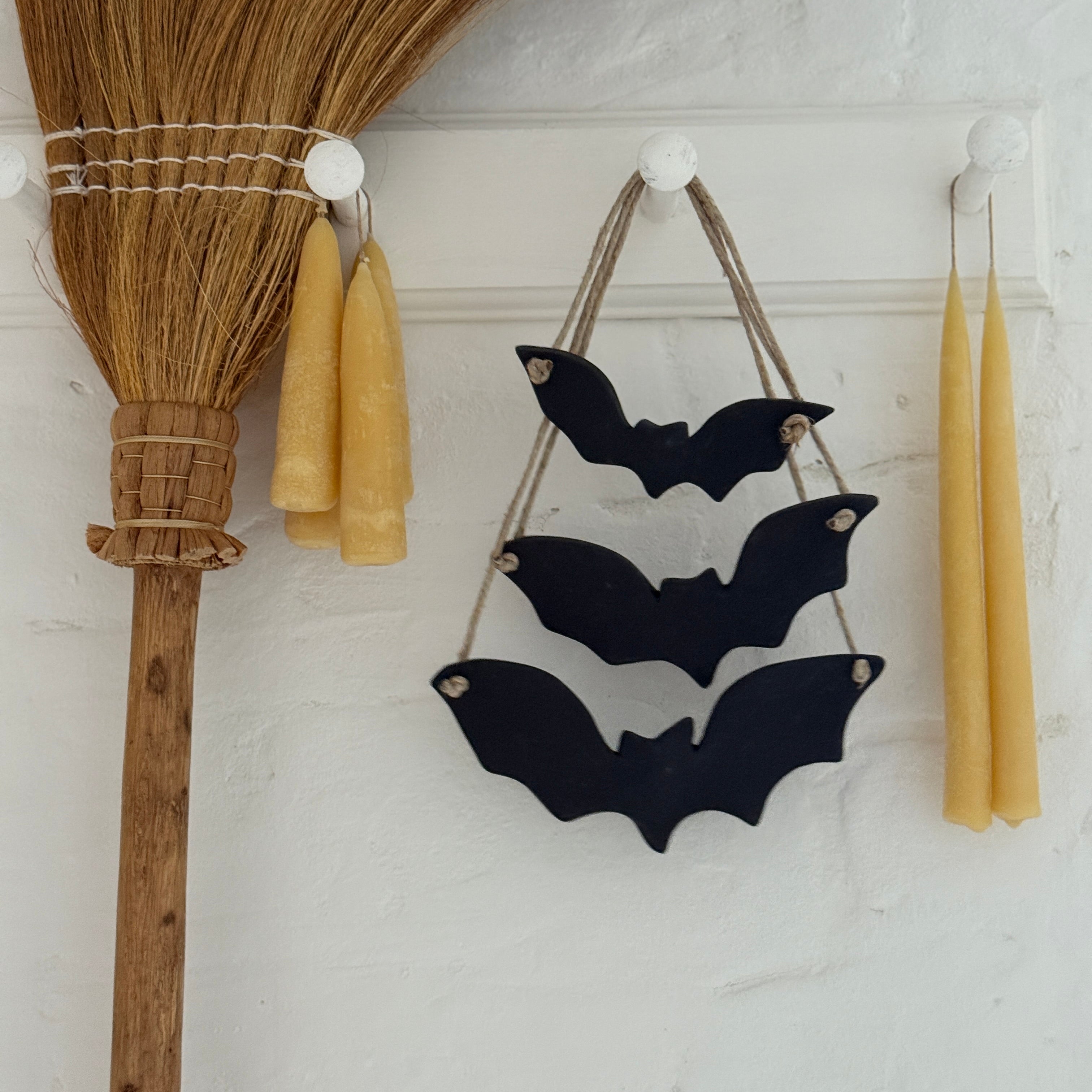 Handmade stoneware bat ornaments in three sizes for hanging on knobs, branches, or wreaths.