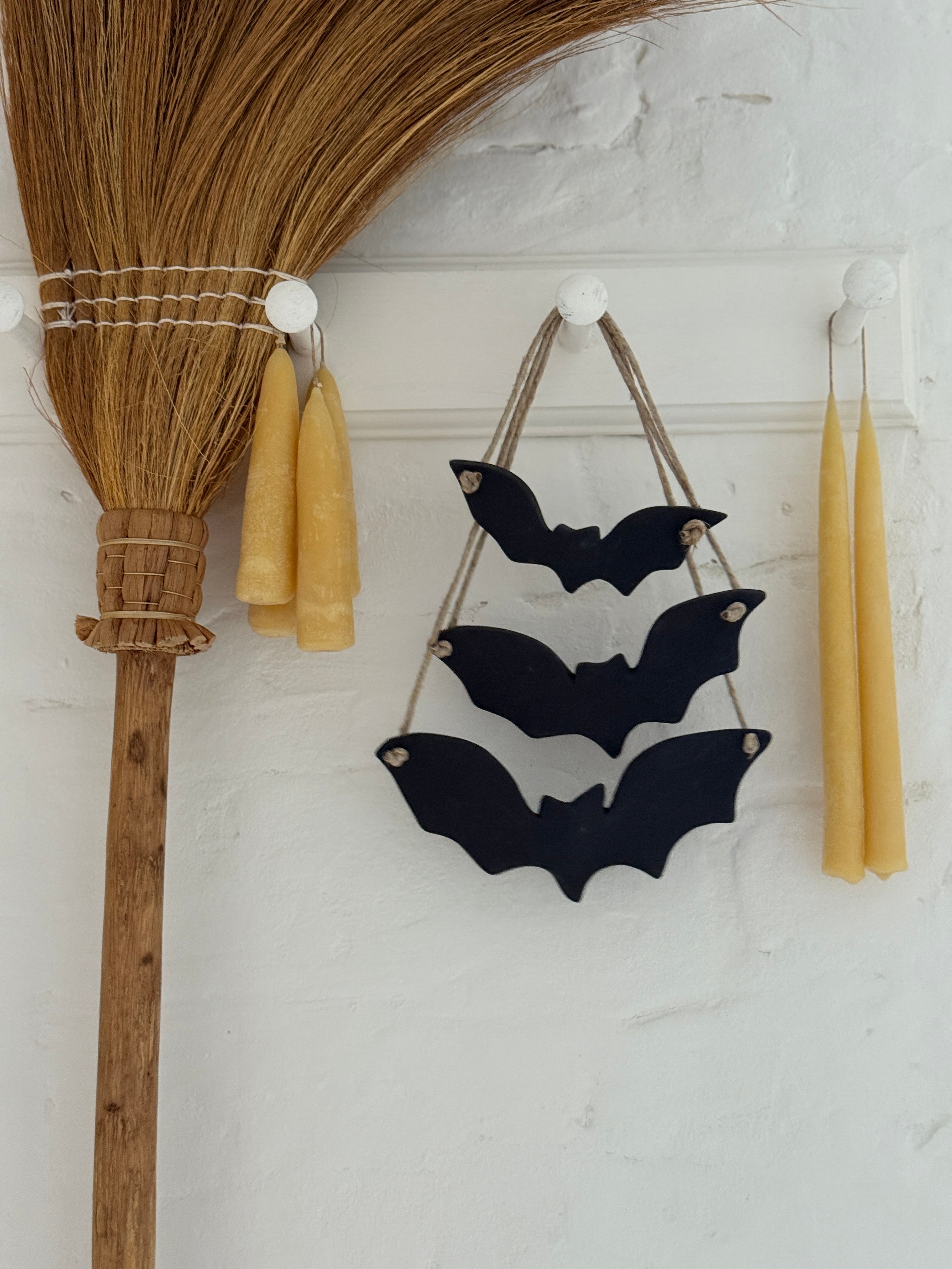 Handmade stoneware bat ornaments in three sizes for hanging on knobs, branches, or wreaths.