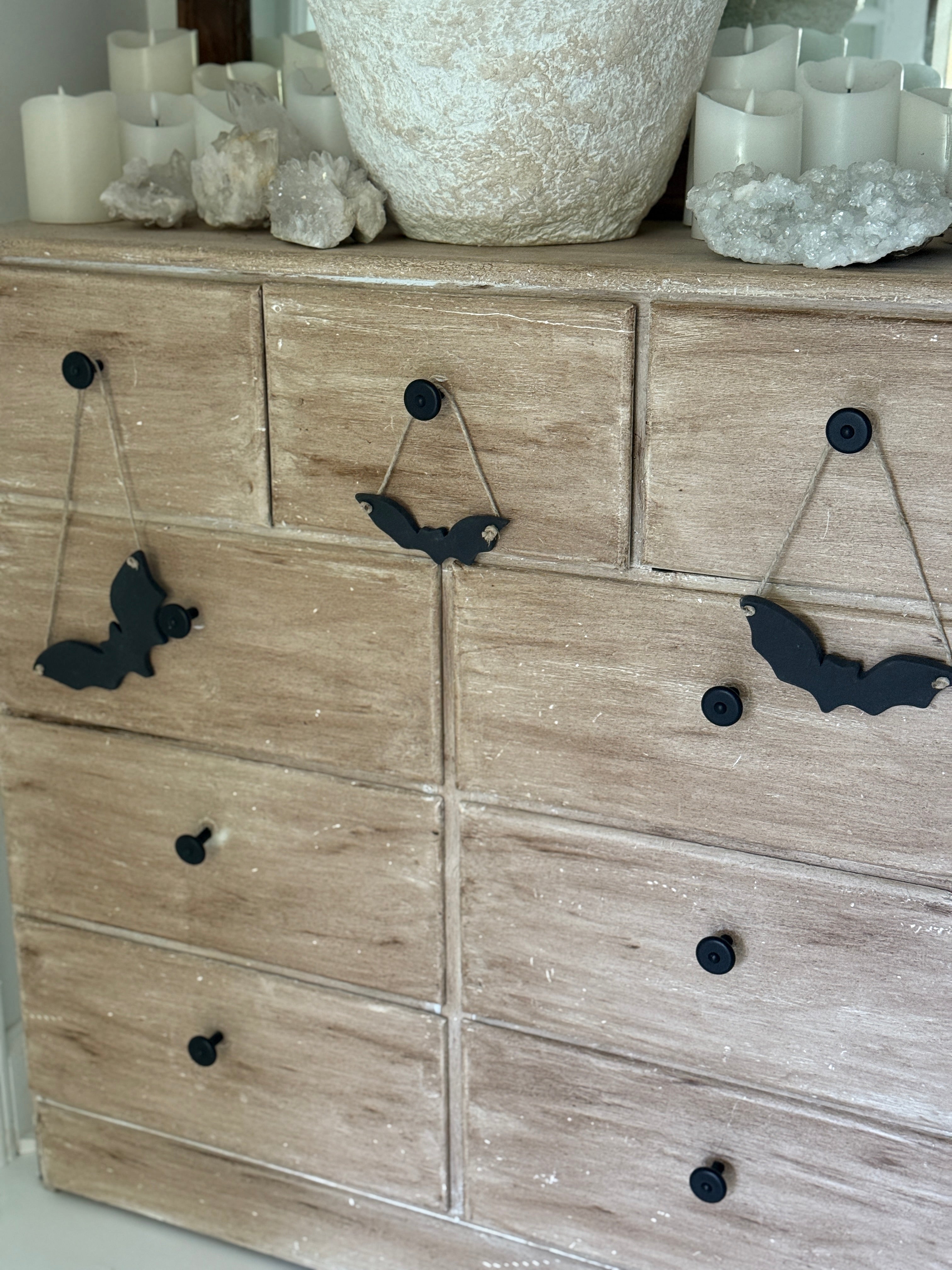 Handmade stoneware bat ornaments in three sizes for hanging on knobs, branches, or wreaths.