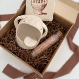Handmade ceramic Stanley the salt monster crock with a gourmet salt blend, packaged as a gift.