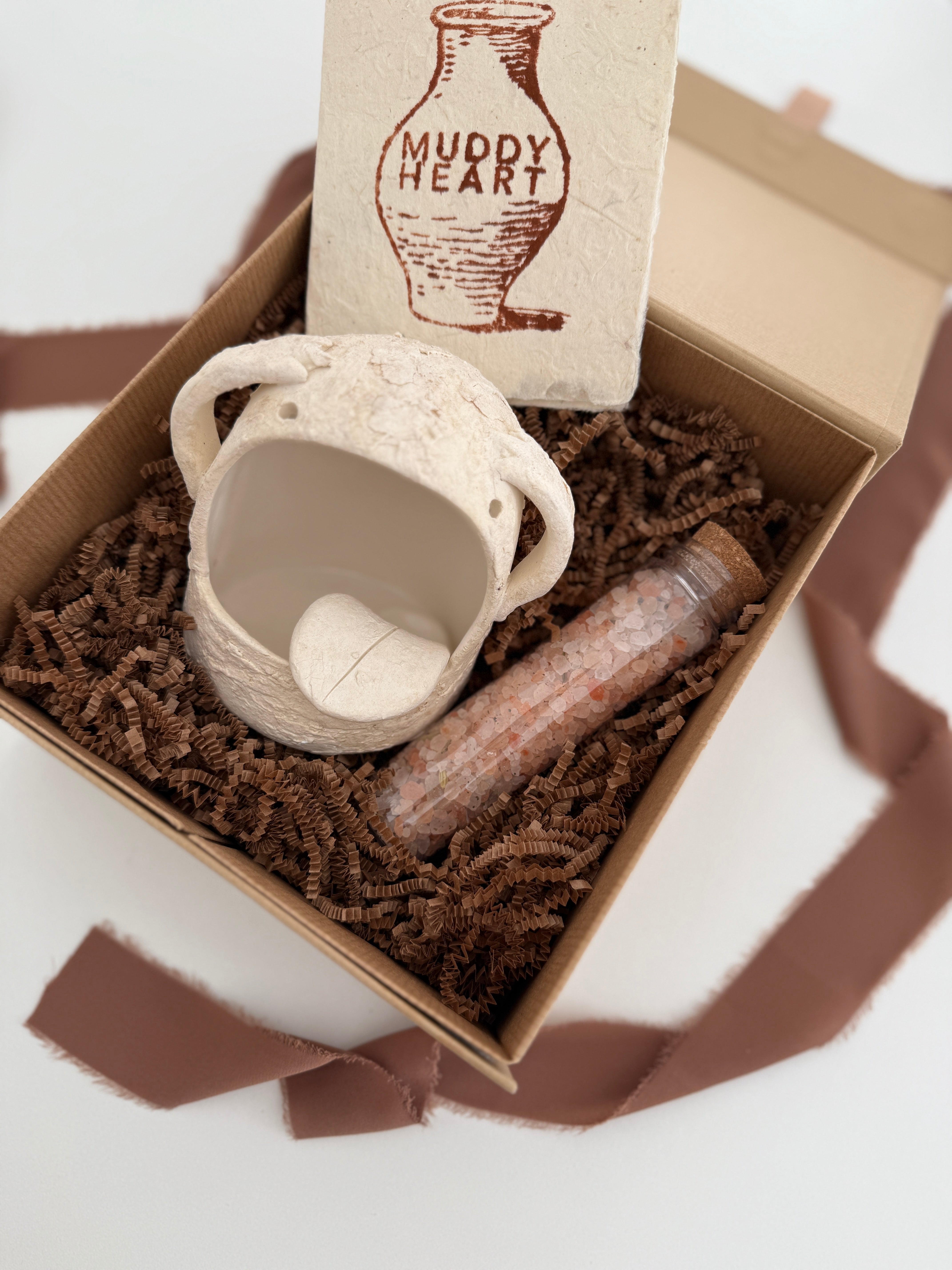 Handmade ceramic Stanley the salt monster crock with a gourmet salt blend, packaged as a gift.