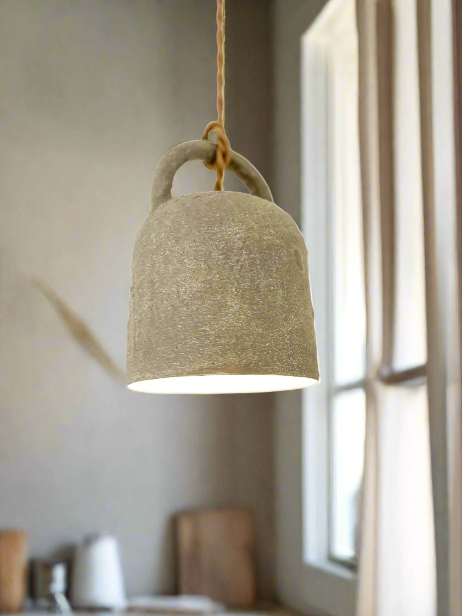 Handmade ceramic barrel pendant light in a neutral glaze