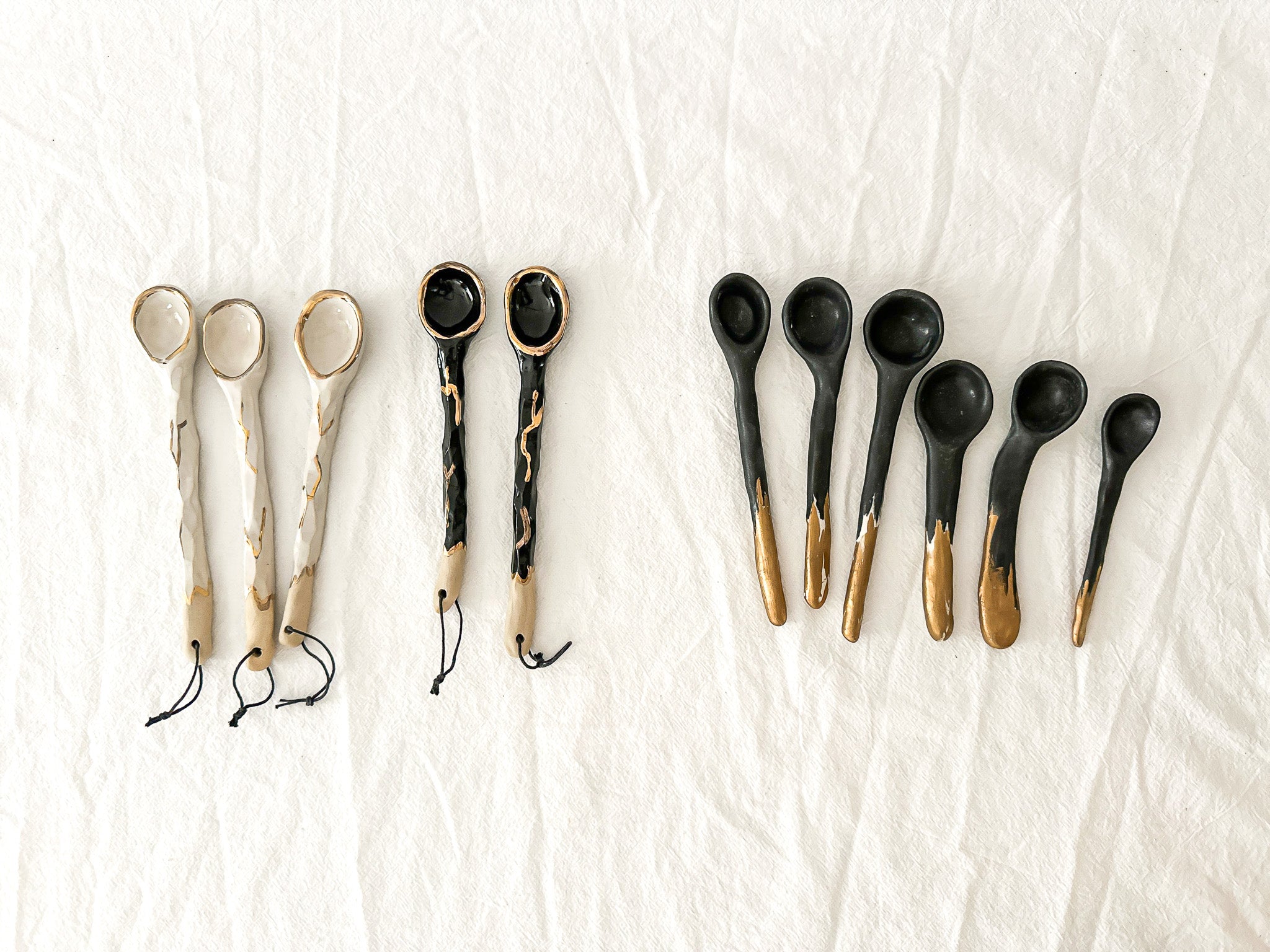 Hand-carved ceramic serving spoon in a moody dark glaze, seconds sale