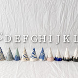Blue marbled ceramic ring holder cone with a tapered point, handmade