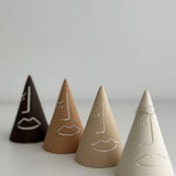 Unique abstract face ring holders in brown, tan, and beige