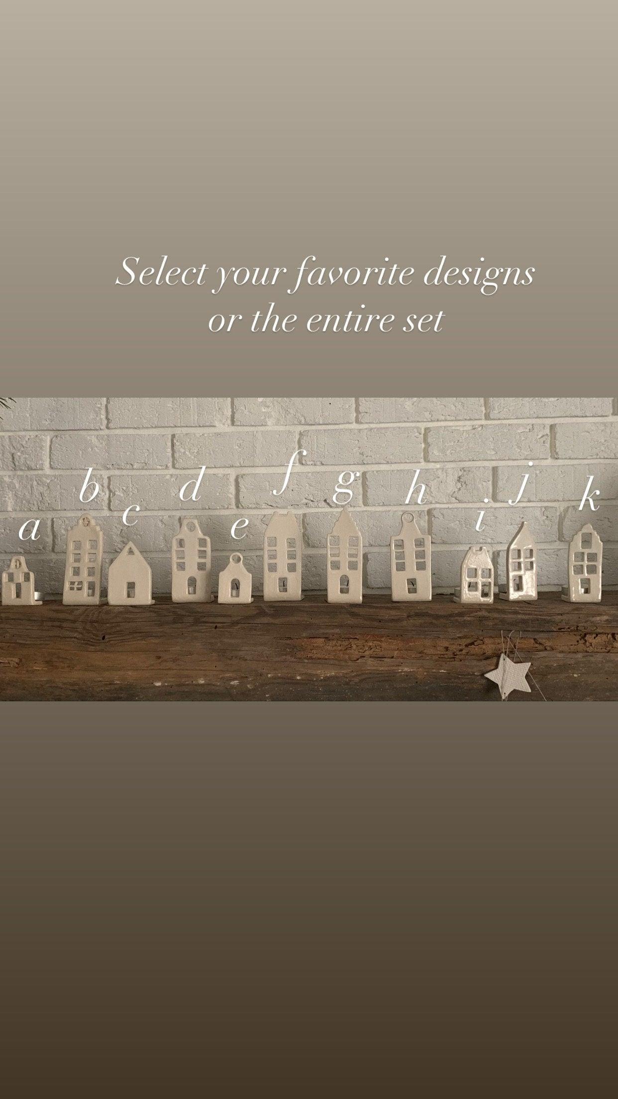 Handmade ceramic tea light houses inspired by Amsterdam canal homes