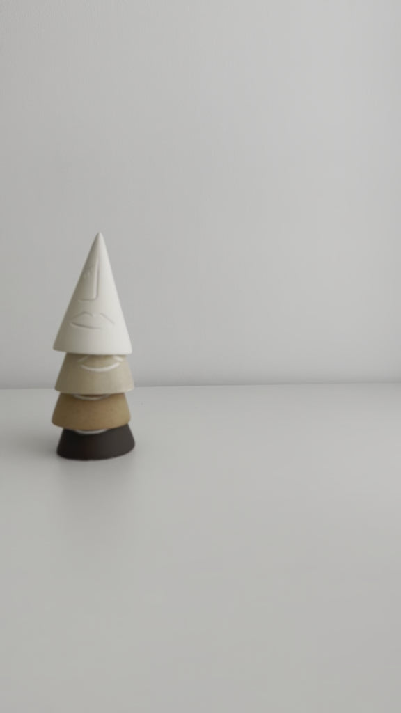 Neutral tone ring cones with abstract face illustrations for modern decor
