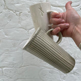 Handmade tall stoneware mug with star or stripe design