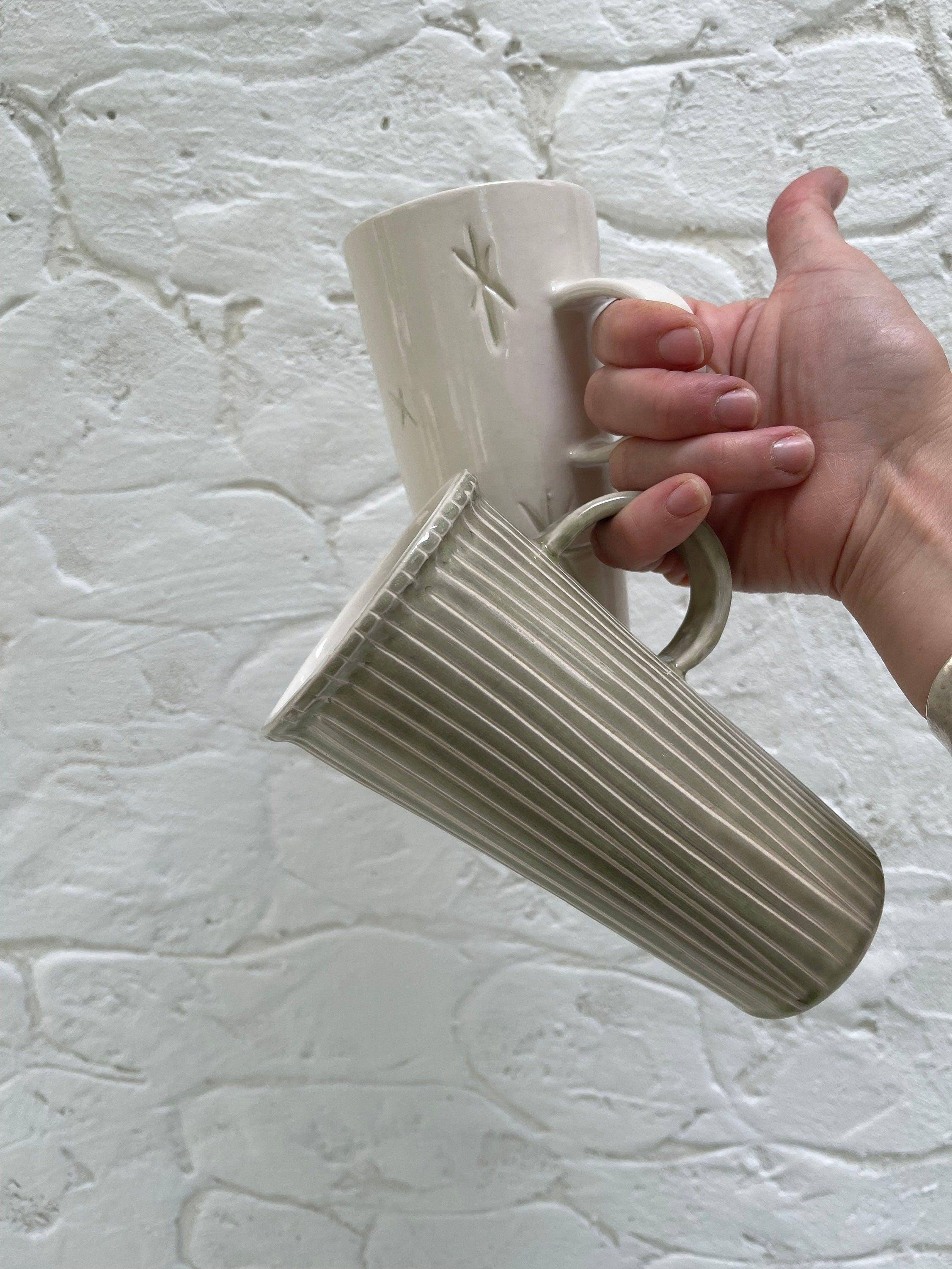 Handmade tall stoneware mug with star or stripe design