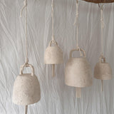 Handmade ceramic wish bell shown in a neutral glaze finish