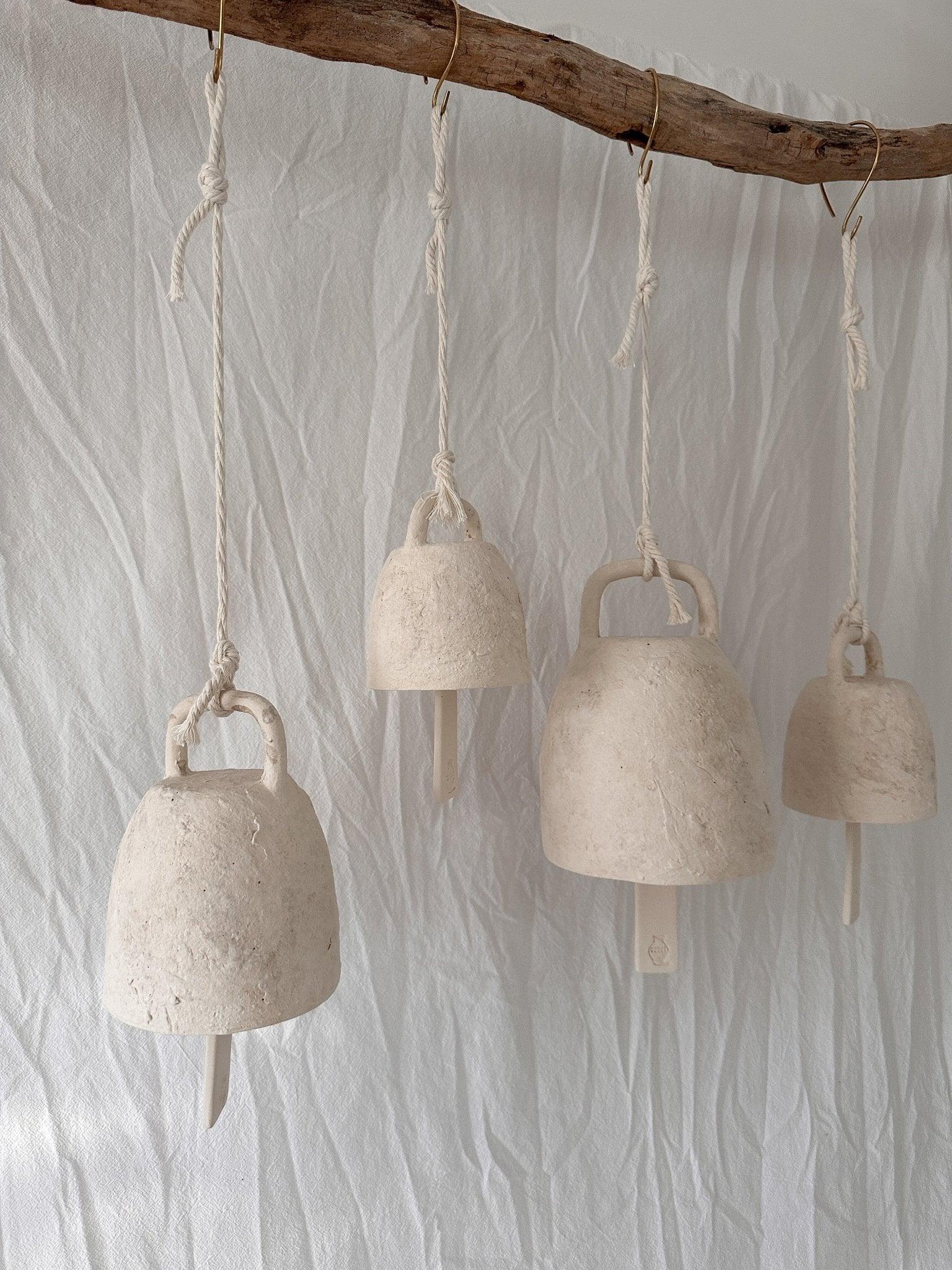Handmade ceramic wish bell shown in a neutral glaze finish