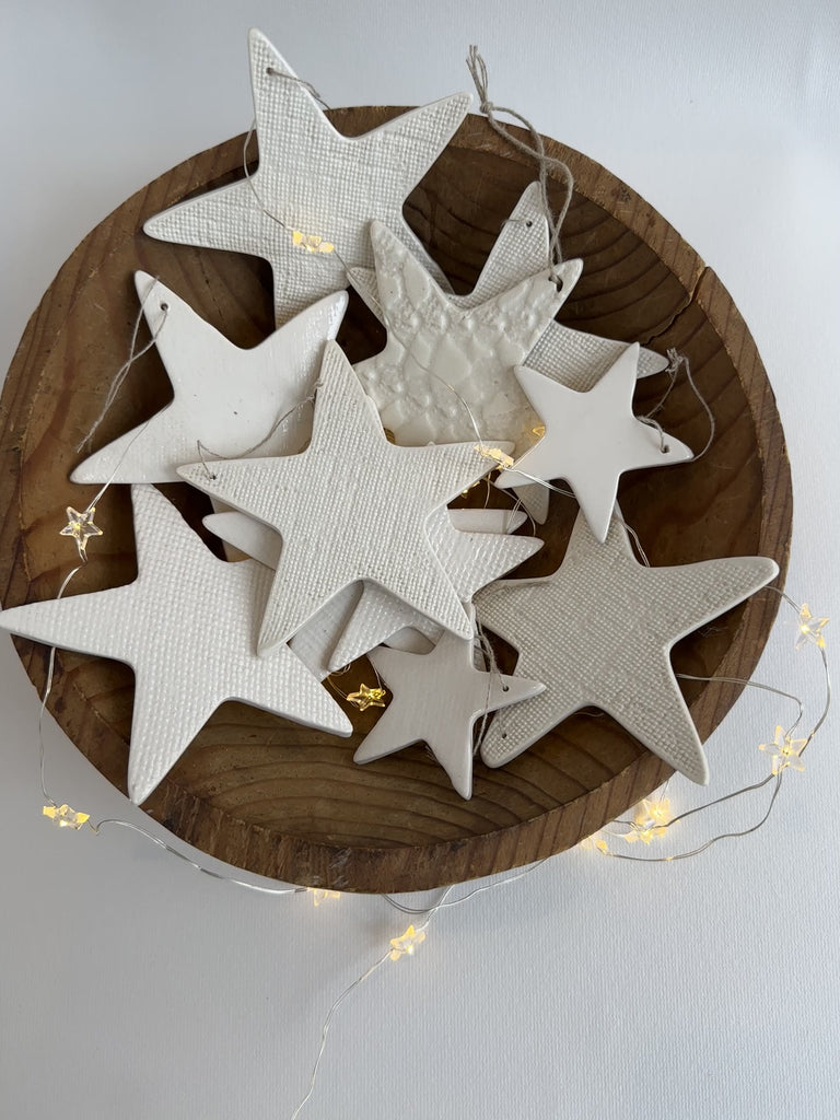 Elegant and unique white ceramic star ornaments, artisan-crafted for your holiday decor