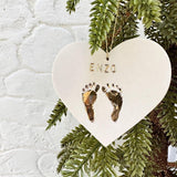 Custom baby name ornament with gold footprint design