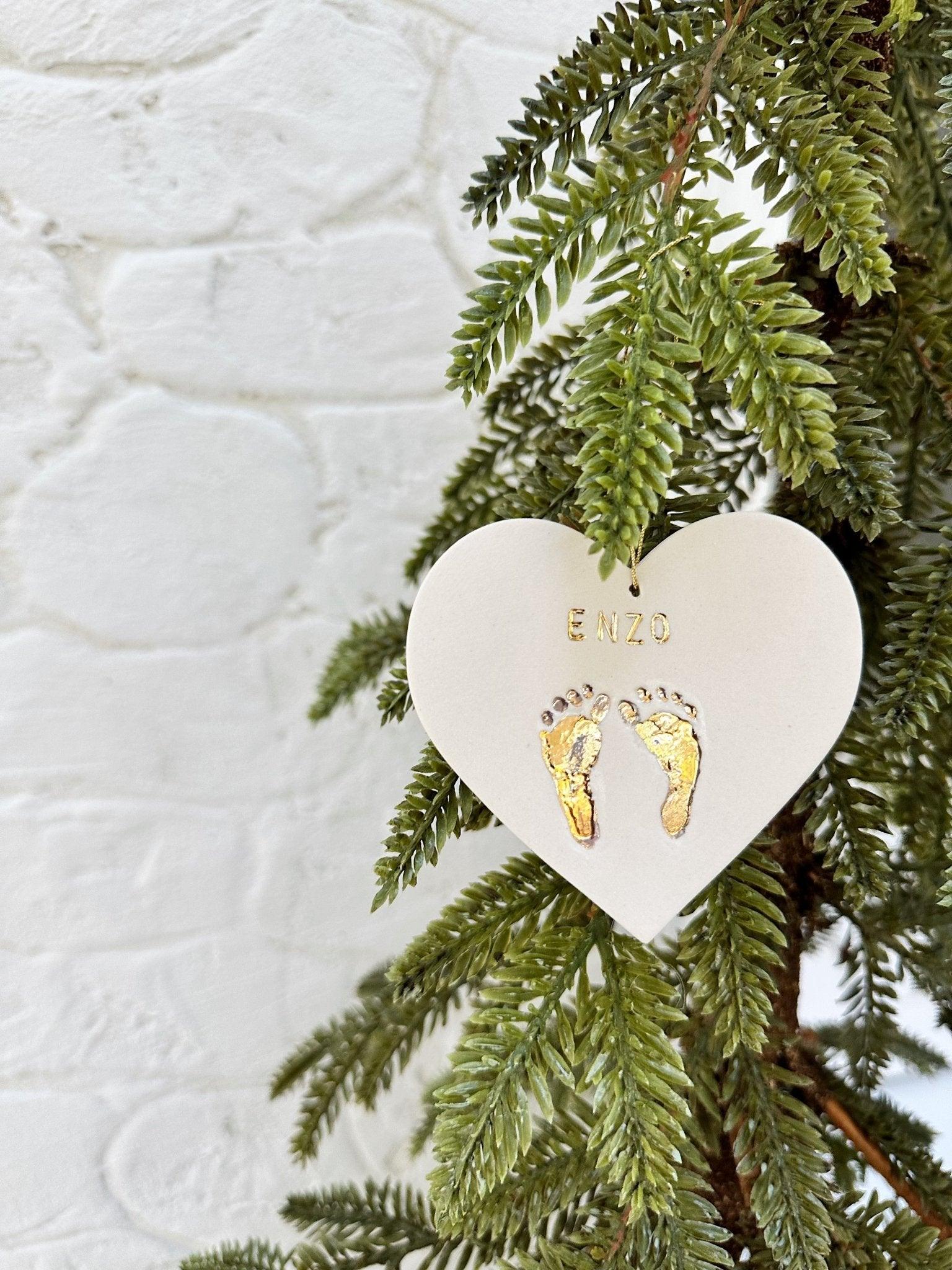 Unique baby name ornament in ceramic with gold footprints