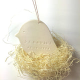 Personalized ceramic bird nest ornament, close-up of custom text detail