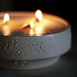 Hand-poured soy candle in a large textured ceramic centerpiece vessel