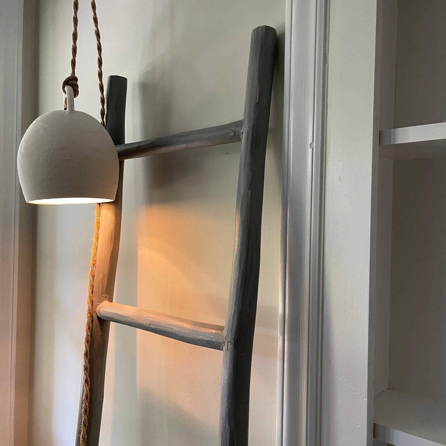 Handmade ceramic bell pendant light in a neutral finish