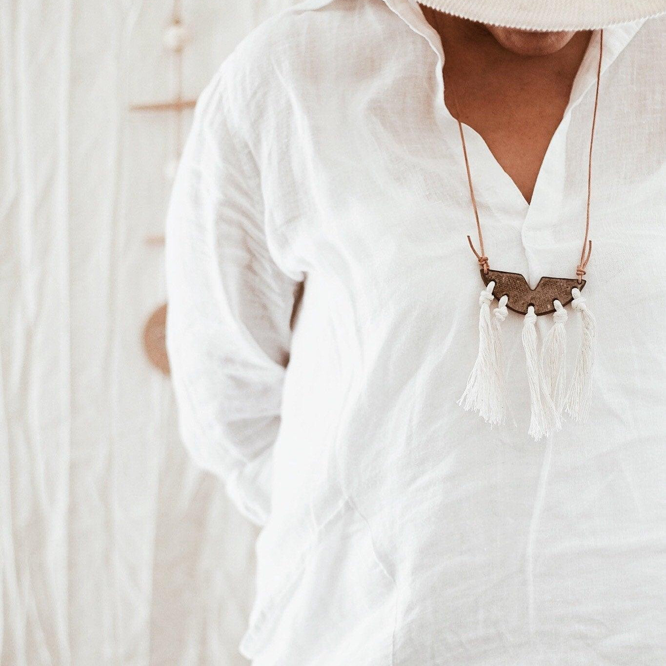 Handmade ceramic pendant necklace with leather tassel by Muddy Heart