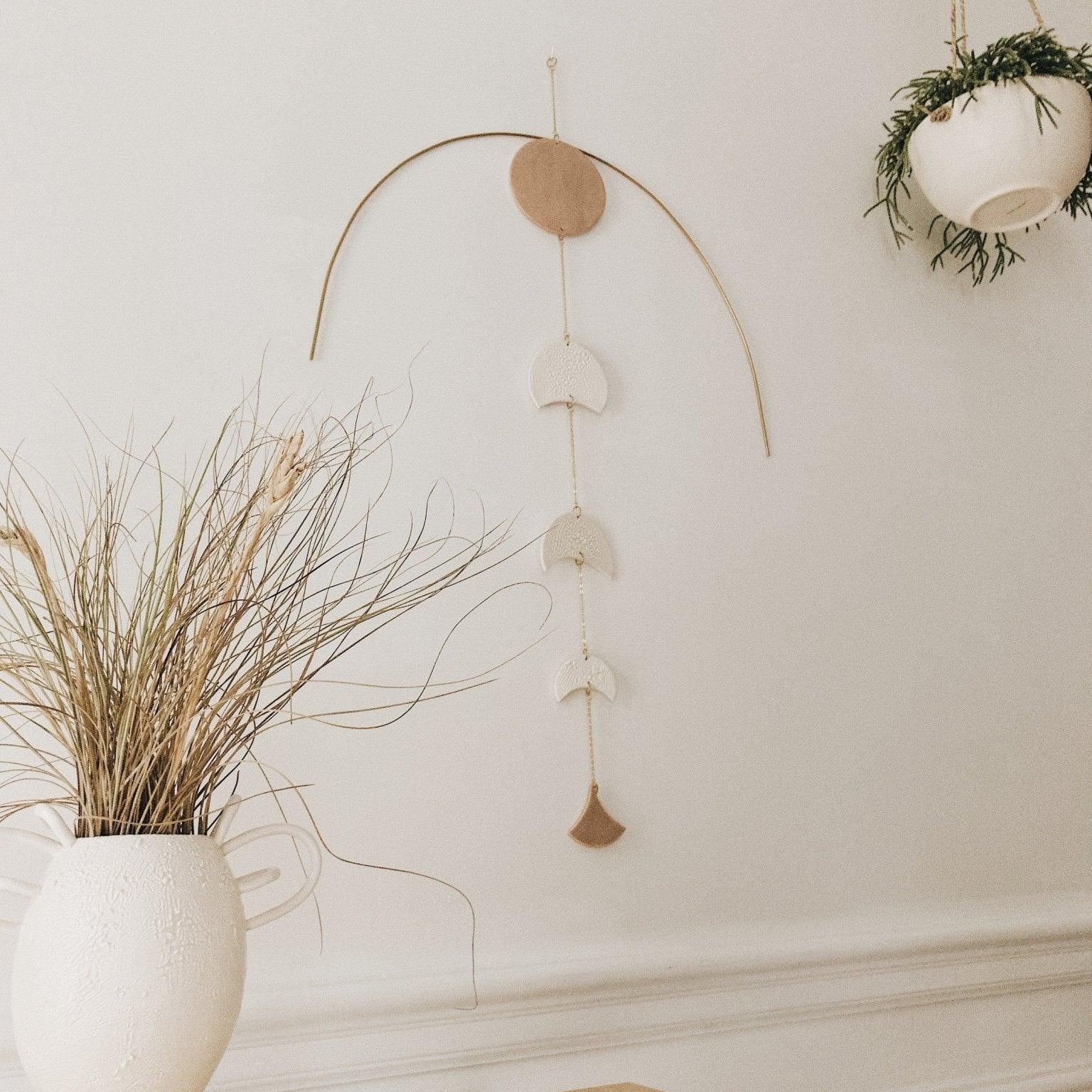Handmade stoneware eclipse wall art with metal accents in neutral tones by Muddy Heart