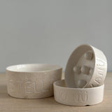 Personalized handmade ceramic pet bowl hand-lettered with a pet's name