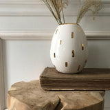 Handmade ceramic pod vase with 22-karat gold luster accent in a neutral glaze by Muddy Heart