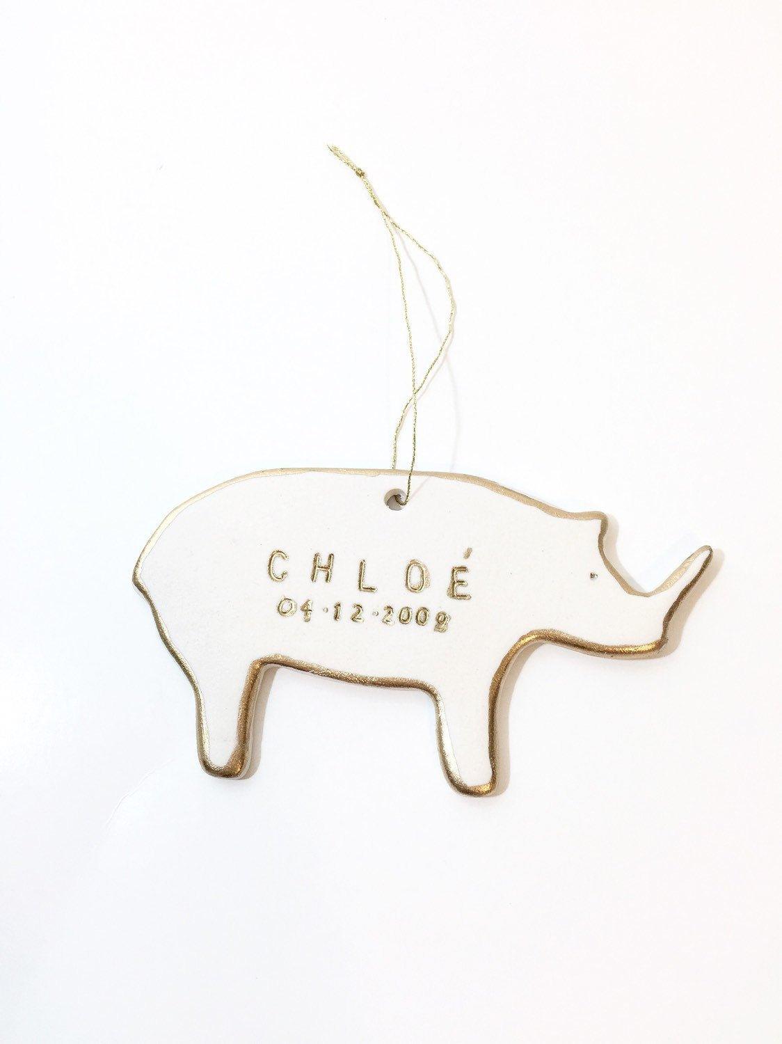 Handmade porcelain rhino ornament with 22K gold luster and custom name by Muddy Heart
