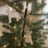 Handmade porcelain rhino ornament with 22K gold luster and custom name by Muddy Heart