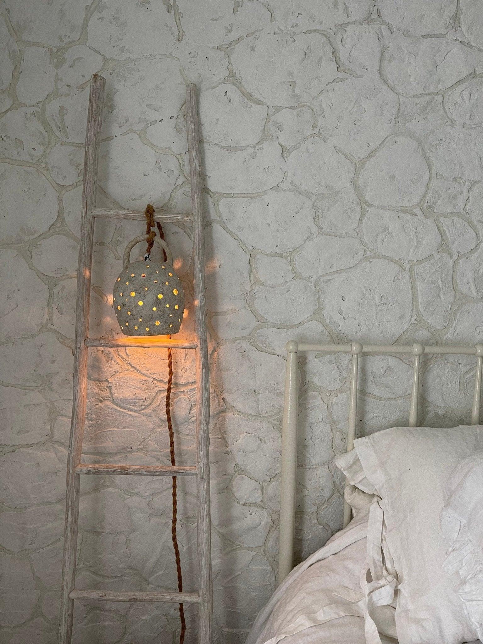 Handmade stoneware pendant lamp with hand-carved star cutouts
