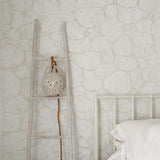 Handmade stoneware pendant lamp with hand-carved star cutouts