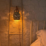 Handmade stoneware pendant lamp with hand-carved star cutouts