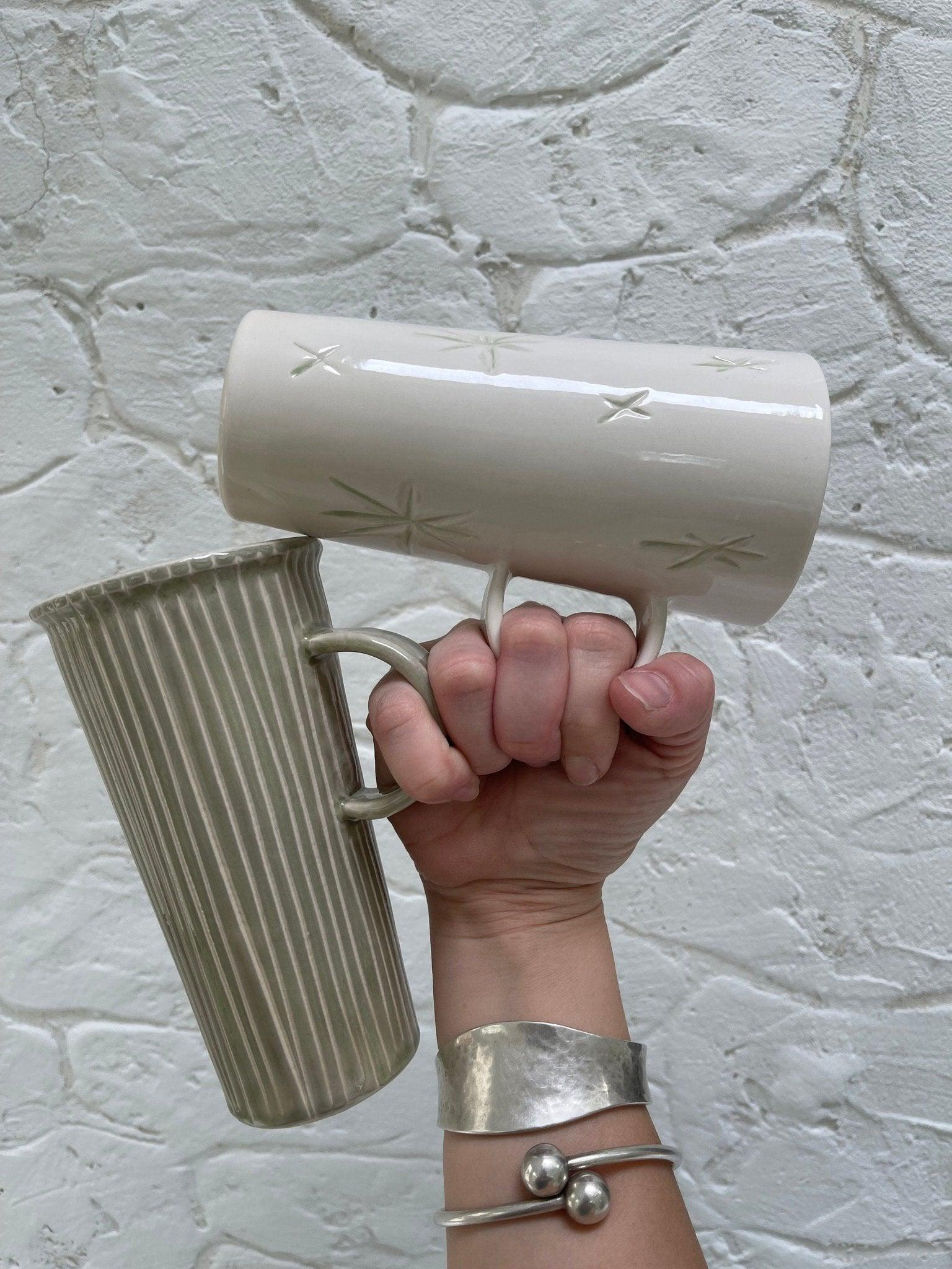 Handmade tall stoneware mug with star or stripe design