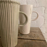 Handmade tall stoneware mug with star or stripe design